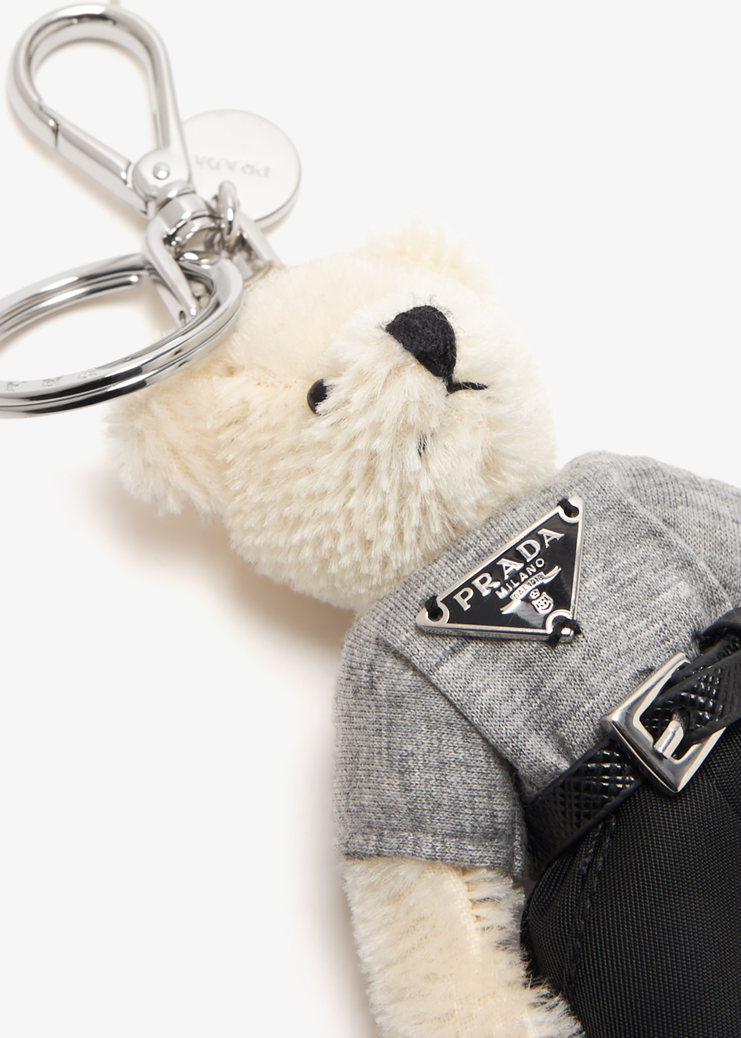 Prada Teddy bag charm for Men - White in UAE | Level Shoes