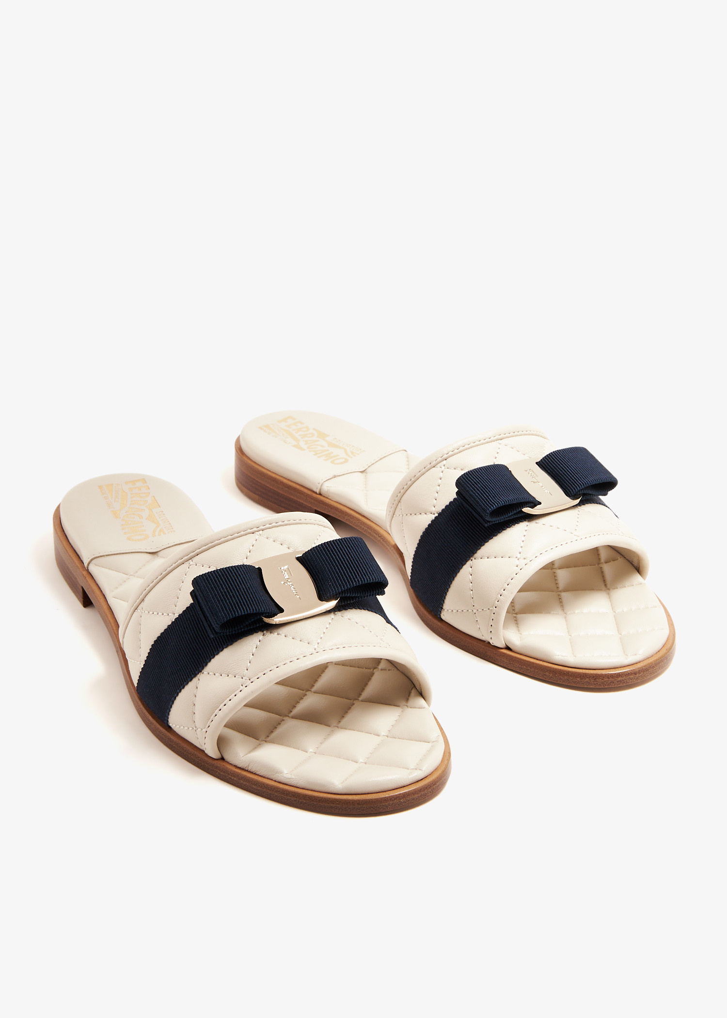 Ferragamo Vara bow slides for Women - White in UAE | Level Shoes