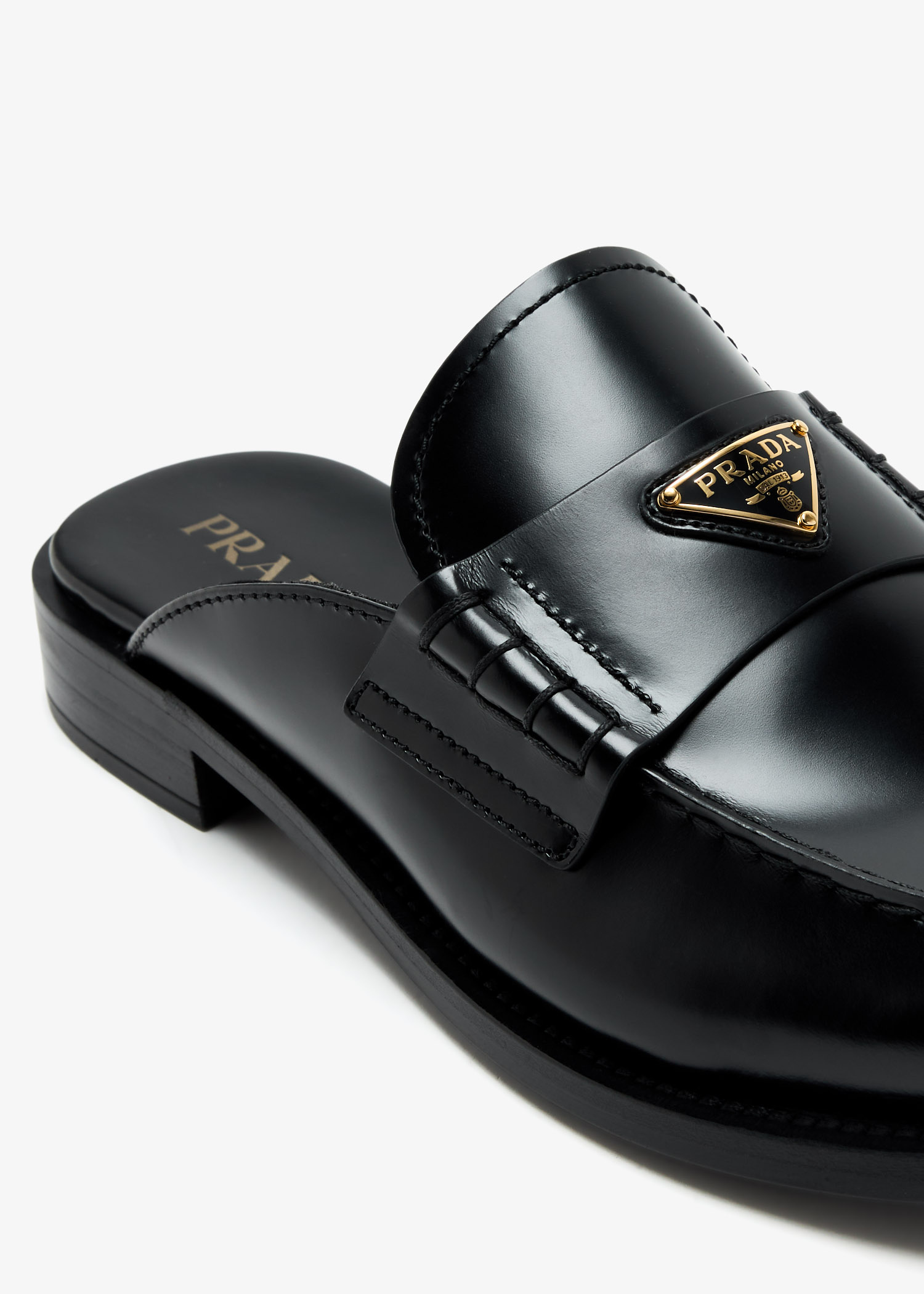 Prada Brushed leather mules for Women - Black in UAE | Level Shoes