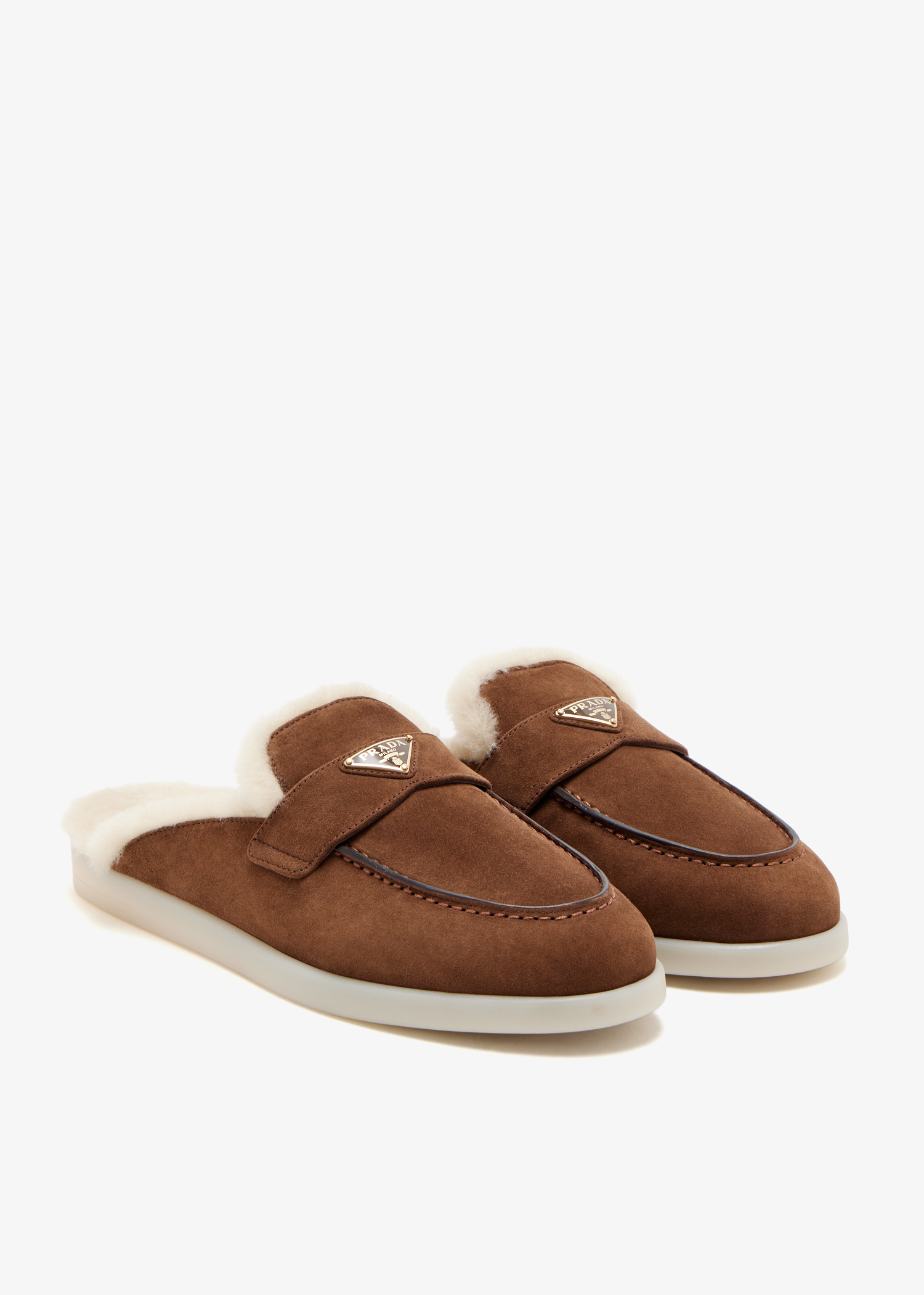 Prada Suede and shearling mules for Women - Brown in UAE | Level Shoes