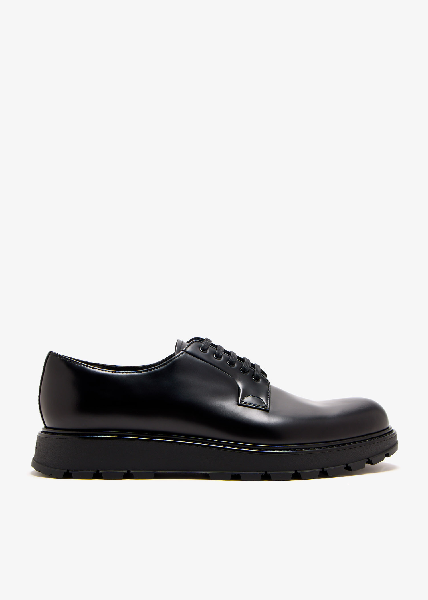 Prada Brushed leather lace-up shoes for Men - Black in UAE