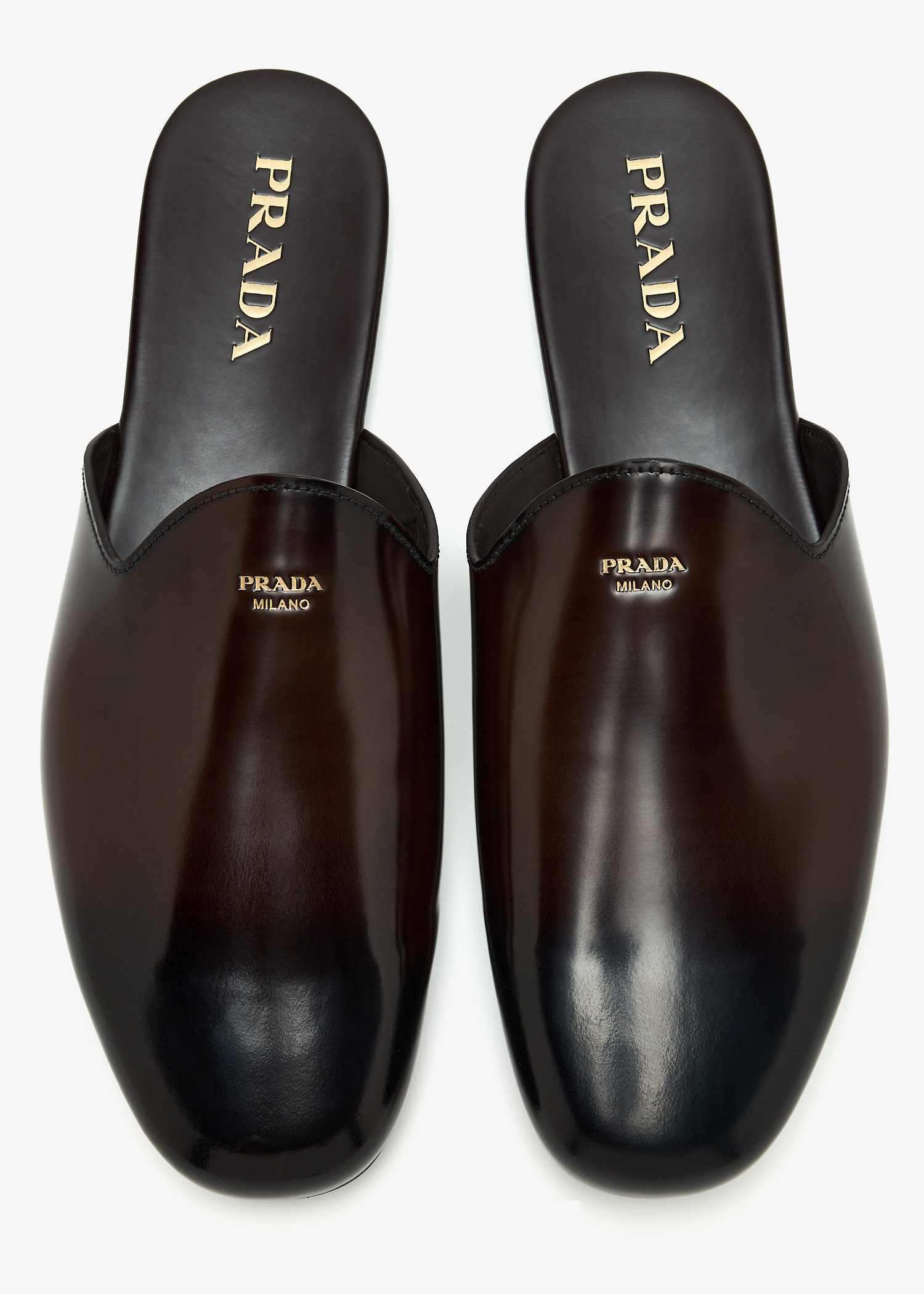 Prada Brushed leather mules for Men - Brown in UAE | Level Shoes