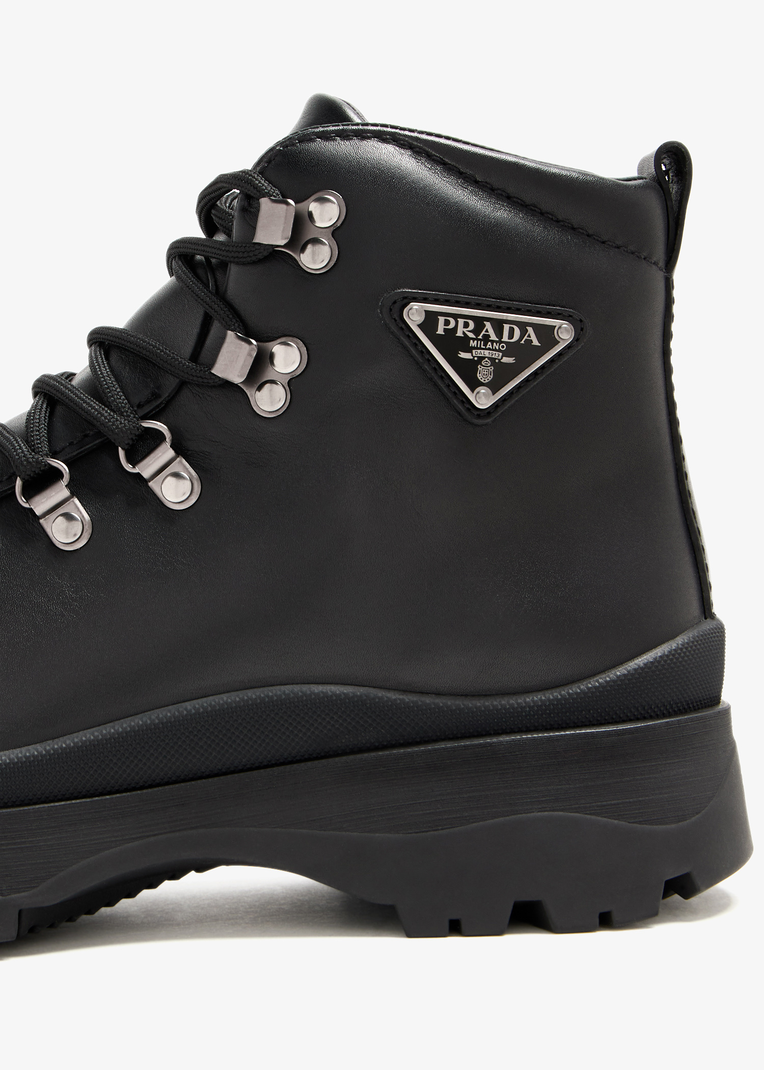 Prada Brixxen leather booties for Men - Black in UAE | Level Shoes