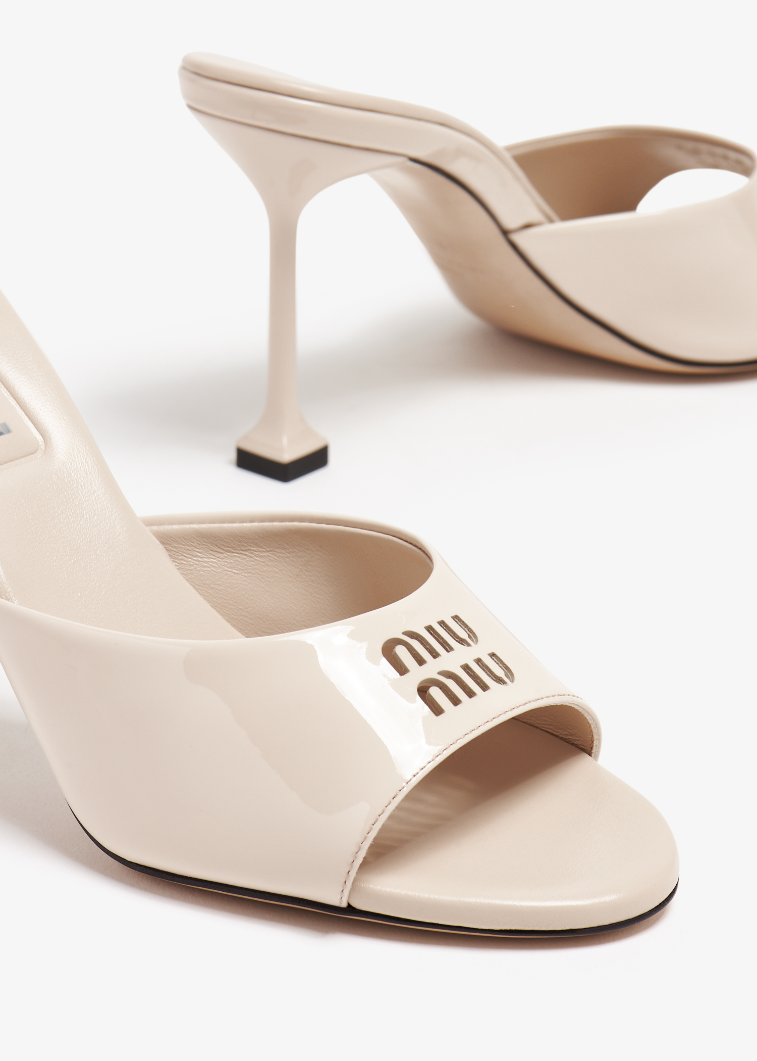Miu Miu Patent leather mules for Women - Beige in UAE