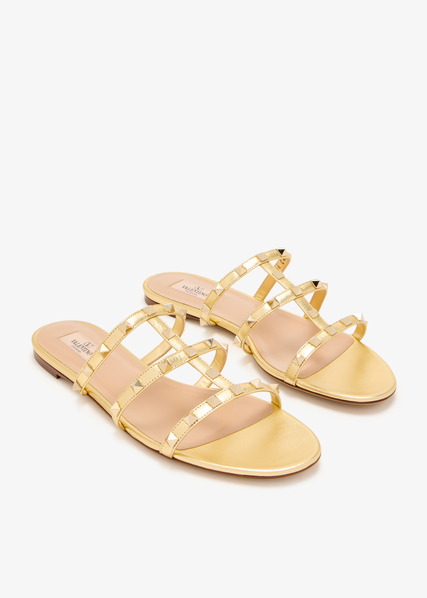 【関税&送料込】Valentino Garavani Gold Leather Rockstuds Ha Rockstud metallic leather slingback flats in gold