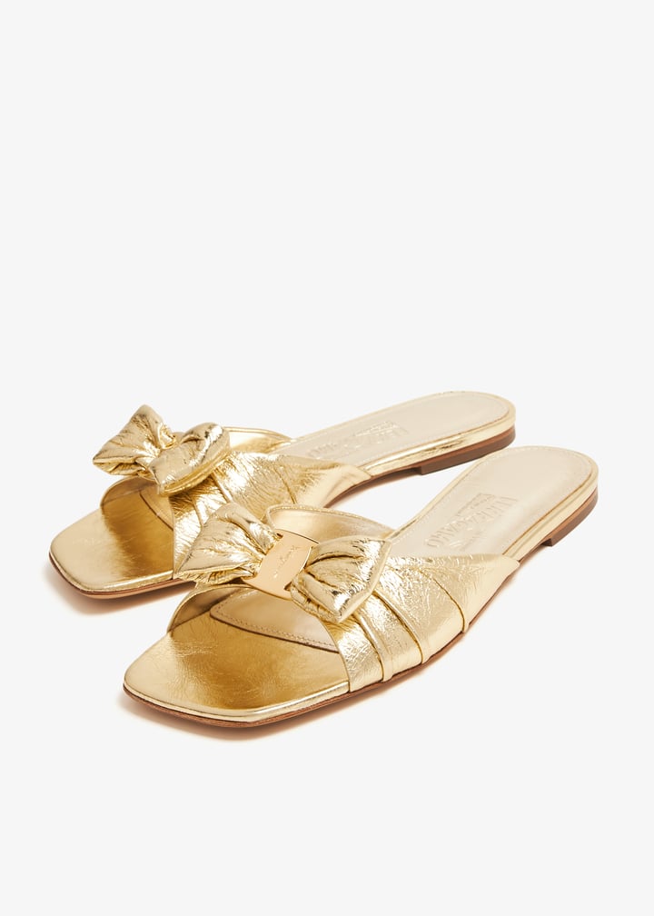 Ferragamo Padded Vara bow slide sandals for Women - Gold in
