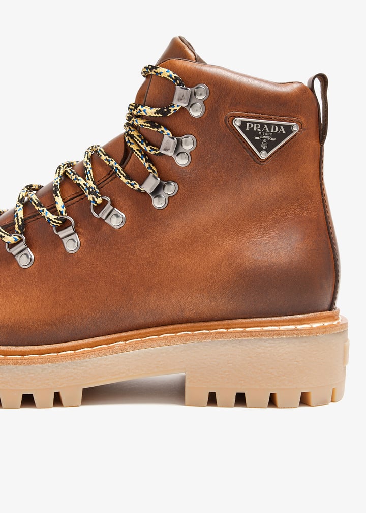 Prada Laced leather booties for Men - Brown in UAE | Level Shoes