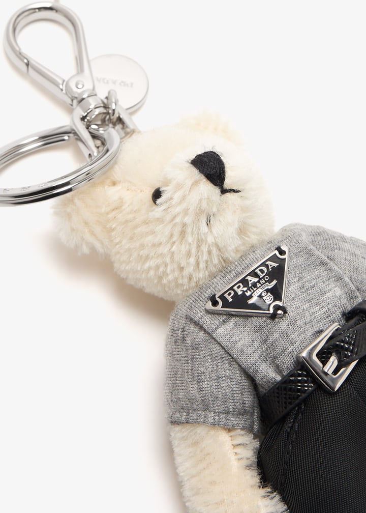 Prada Teddy bag charm for Men - White in UAE | Level Shoes