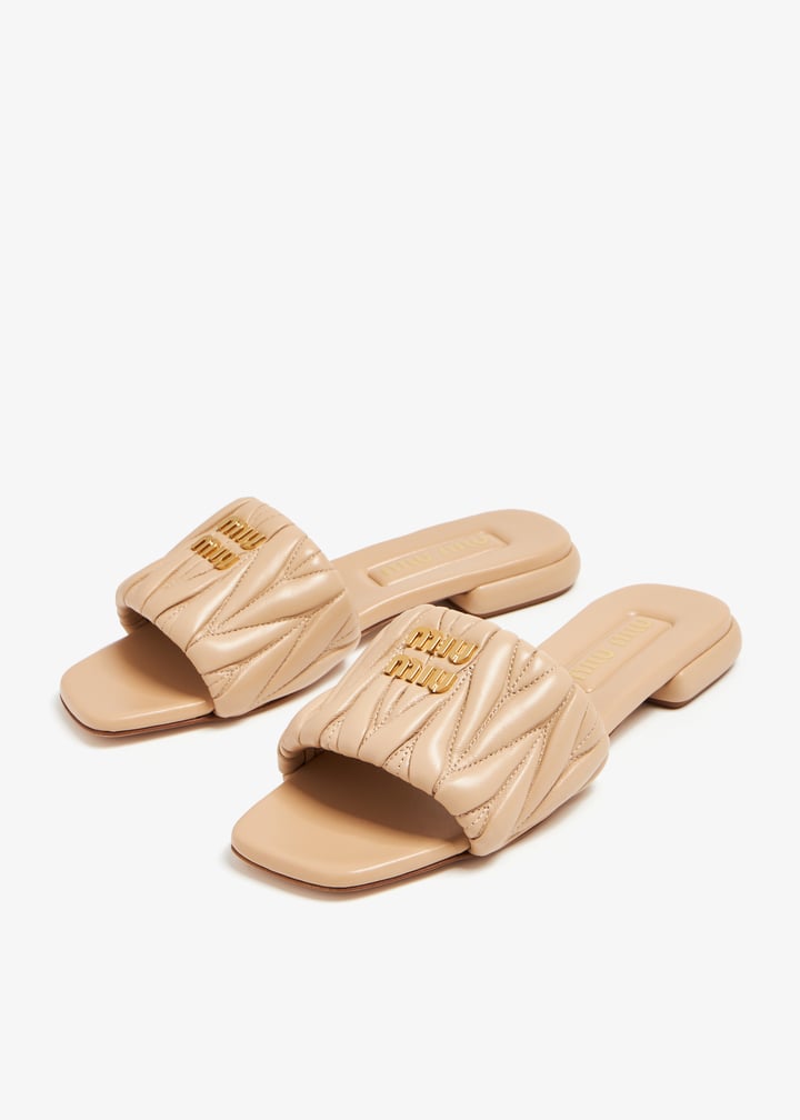 Miu Miu Matelassé leather slide sandals for Women - Beige in