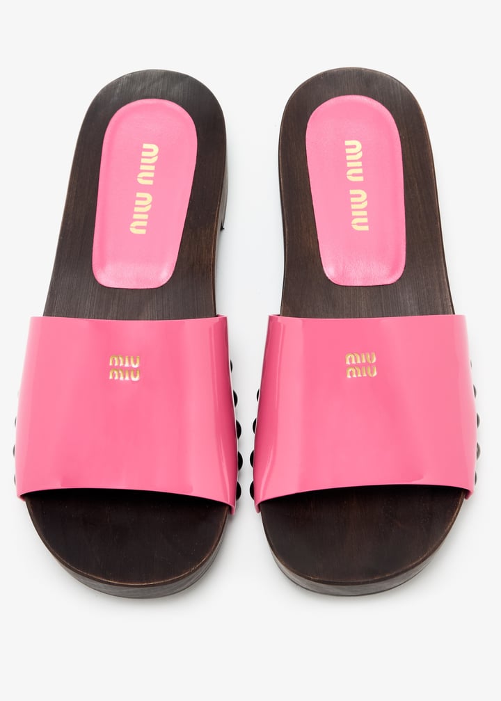 Miu Miu Patent leather clogs for Women - Pink in UAE | Level Shoes