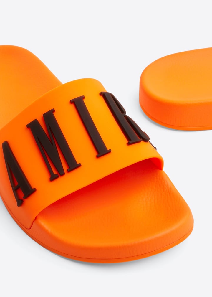 AMIRI Logo pool slides for Men Orange in KSA Level Shoes