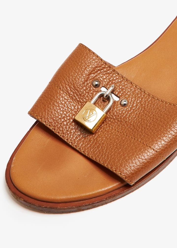 Louis Vuitton Pre-Loved Lock It flat sandals for Women