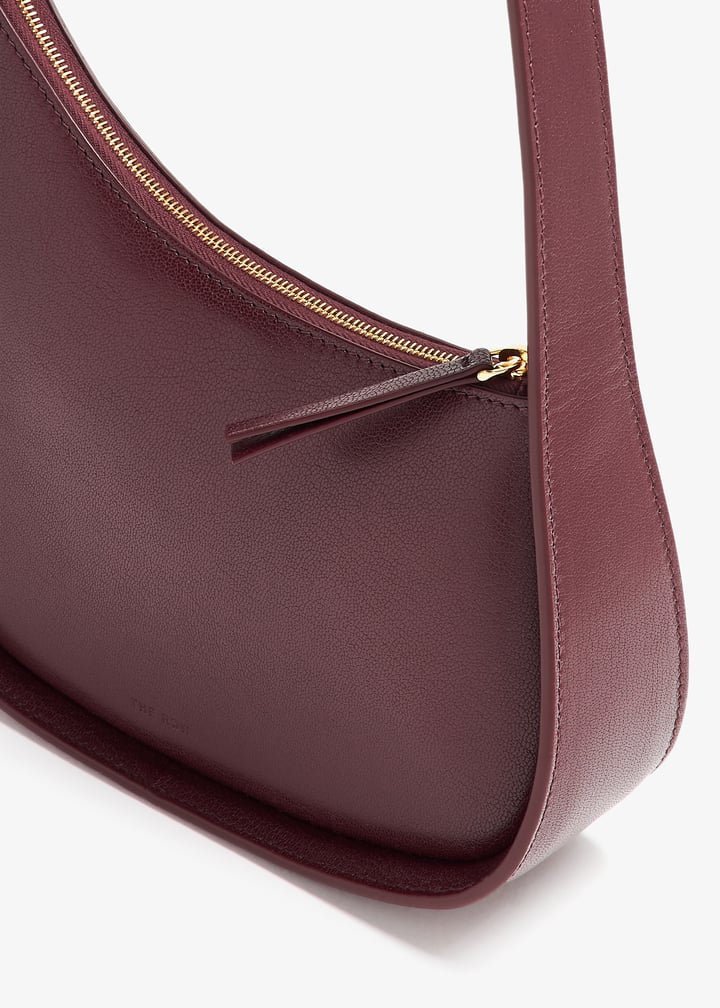 THE ROW｜ (Half Moon Bag (W1249 L39 RNSHG)) The Row Half Moon bag for Women - Burgundy in UAE | Level Shoes