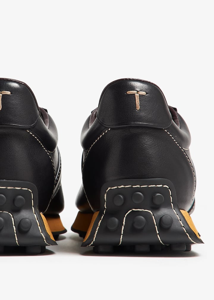 Tod's T Vintage sneakers for Men - Black in USA | Level Shoes