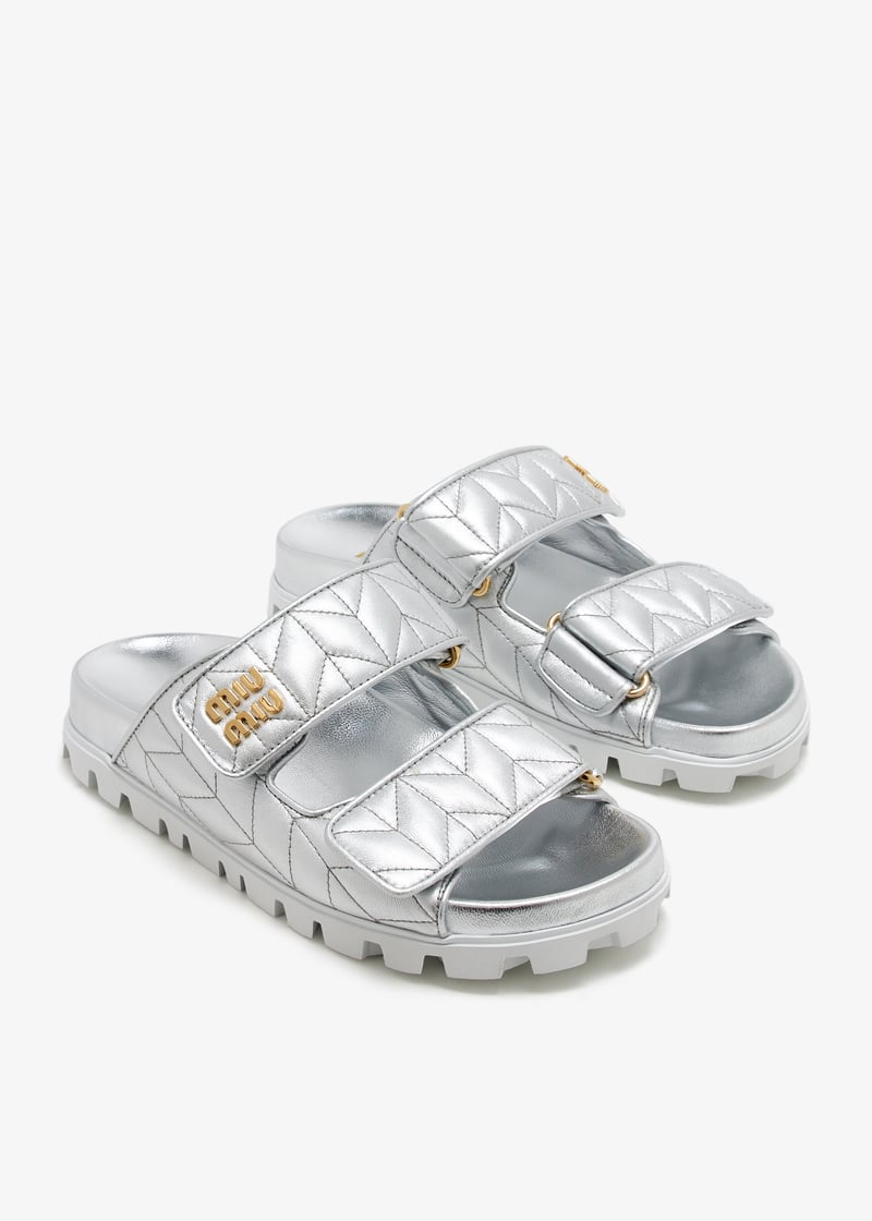 Miu Miu Metallic matelassé nappa leather slides for Women